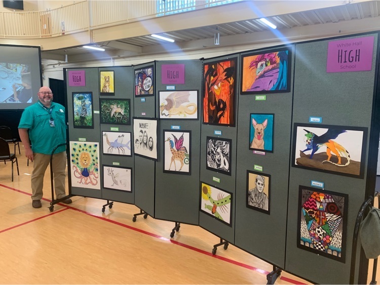 Mr. Bowman proudly shows off his students’ entries at the recent 2022 WHSD Art Showcase!
