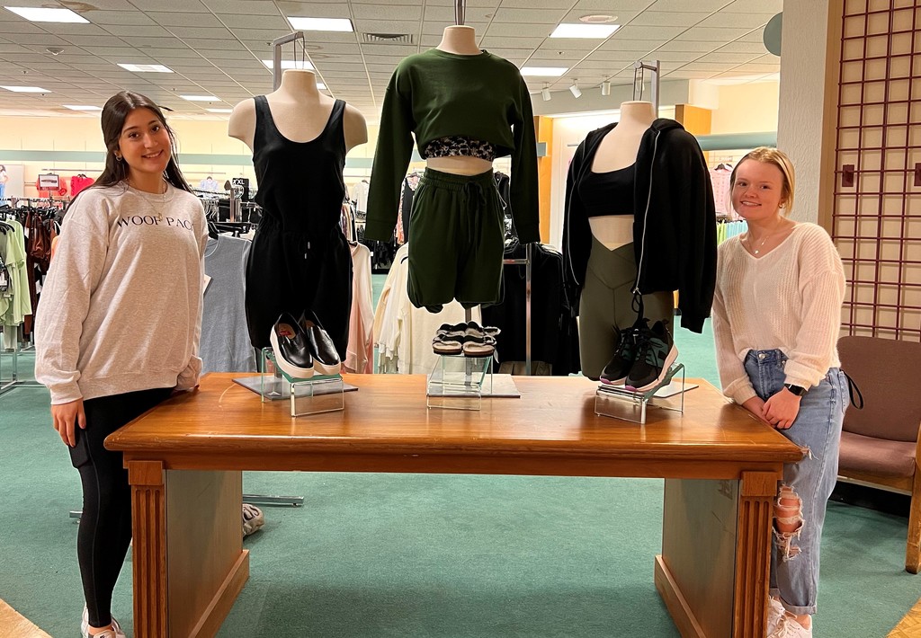 The Advanced Fashion & Interior Design class creating displays at Dillard's.