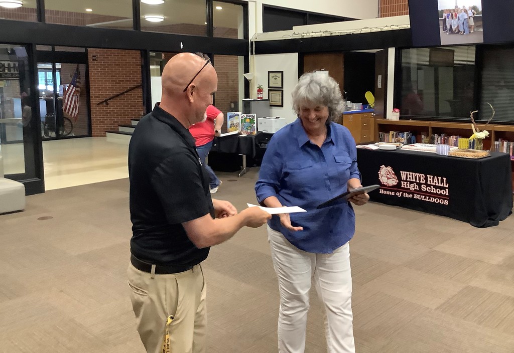 Mrs. Donna Oates is recognized for her years of service.