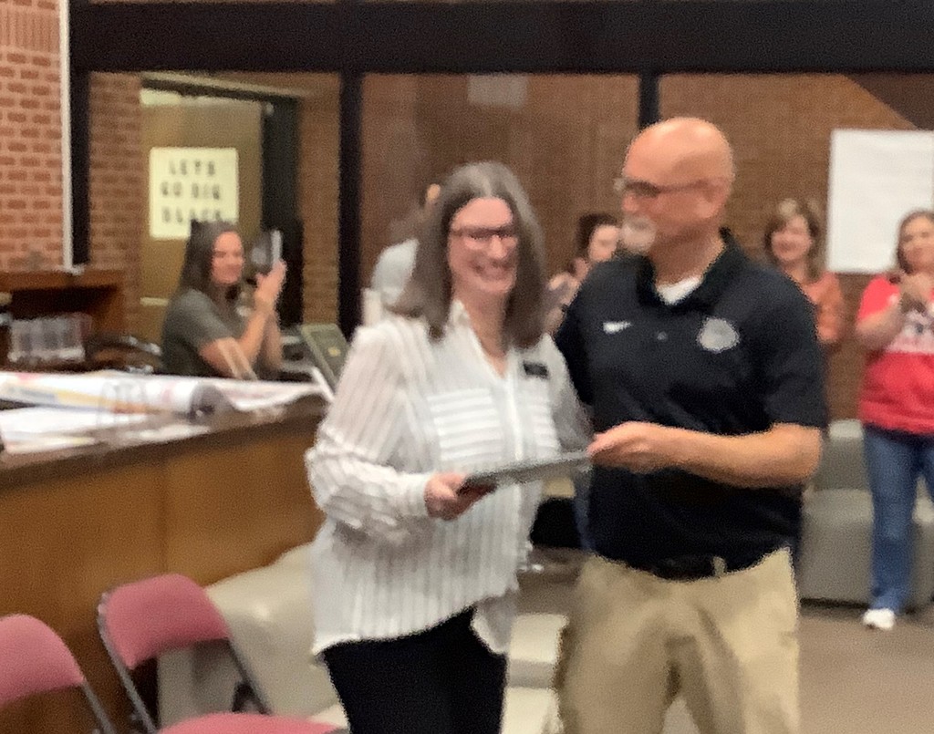 Mrs. Rogers is recognized for her years of service.